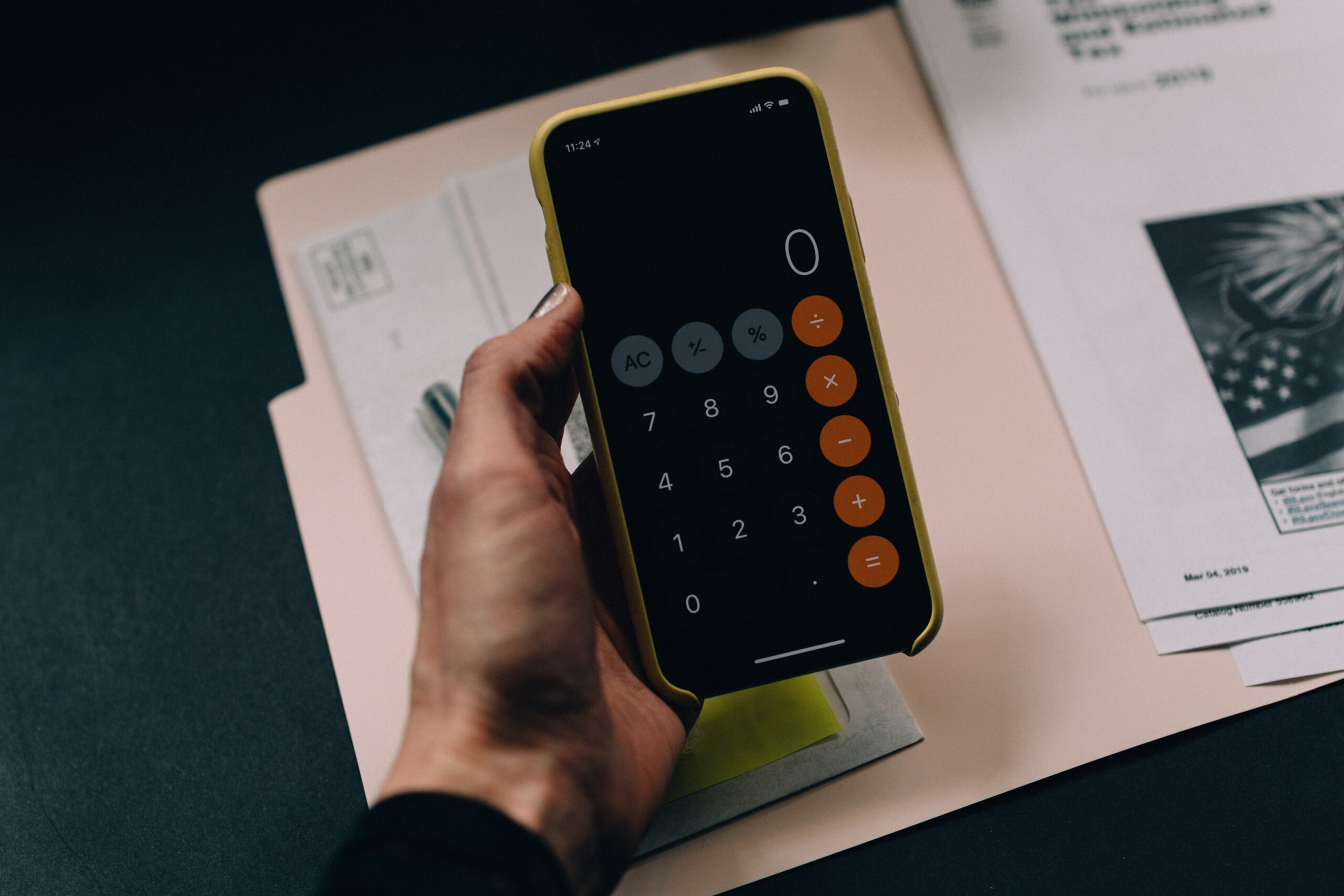Mobile phone showing calculator for monthly budgets